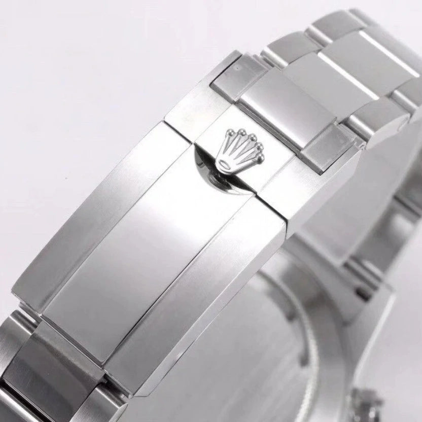 Rolex Cosmograph Daytona with a white dial and a green bezel