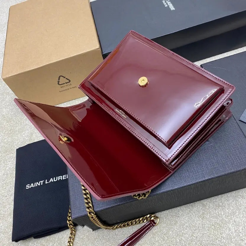 Boutique Quality || YSL Maroon lacquer/Antique gold , Leather Sunset Bag